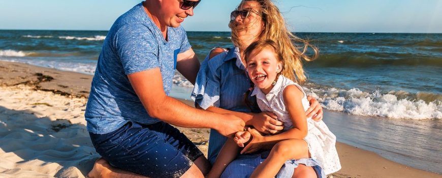 happy young family on the beach